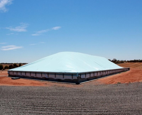 Protective tarpaulin sheet for outdoor grain piles Grain cover solutions for extreme weather conditions