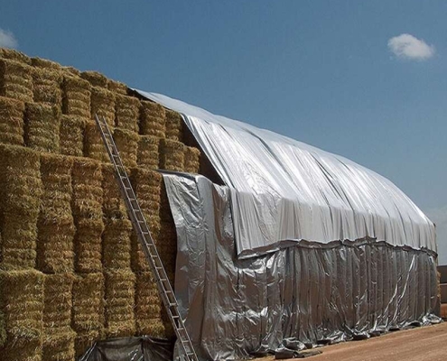 Farm-grade tarps for haystack protection Waterproof poly tarps for hay bale wrapping