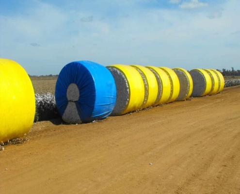 Large cotton module tarps for maximum bale coverage Cotton module tarps with reinforced edges and grommets