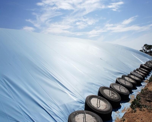 Breathable covers for long-term grain preservation Grain pit and silo covers with weather protection Anti-mildew grain storage tarps for farming